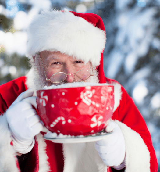 santa enjoying a large cup of coffee