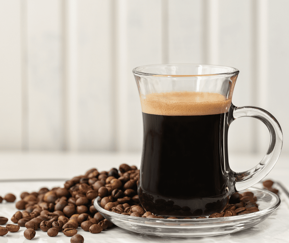 Cup of Strong Single Shot Espresso Coffee in a Glass Cup Stock Photo